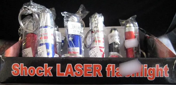 Photo from the official notice: Shock LASER flashlight; Vicces játék laser pointer with shock function — damage to sight & electric shock risk