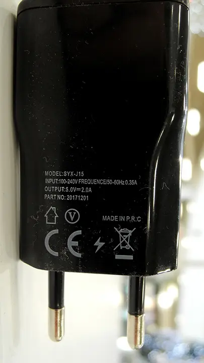 Foto aus der offiziellen Meldung: RMORE Travel Charger USB-Ladegerät — Risiko: Elektrischer Schlag