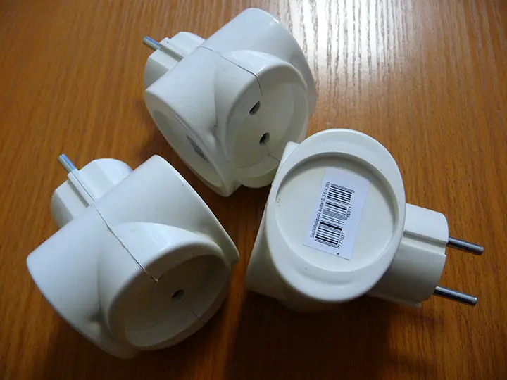 Photo from the official notice: Adapter multiplug socket — burns & electric shock risk