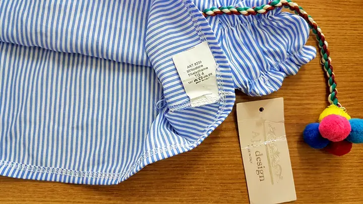 Foto aus der offiziellen Meldung: AJJ DESIGN Kinderbluse — Risiko: Strangulierung