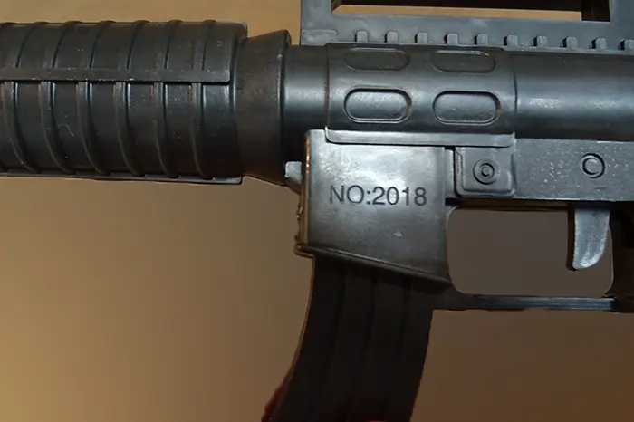 Photo de l’avis officiel: Dekoracja Pistolet à jouet — risque: Étouffement