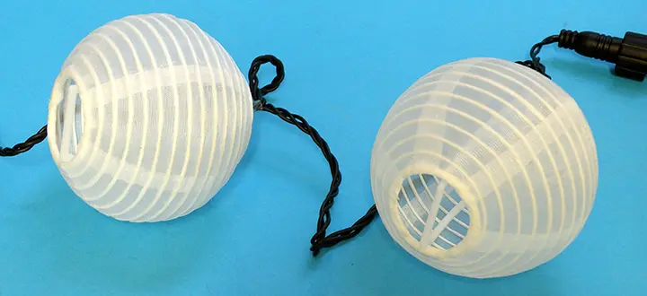 Photo de l’avis officiel: 20 gömbből álló hálózatról működő lampionfüzér Chaîne d’éclairage — risque: Brûlures & Choc électrique