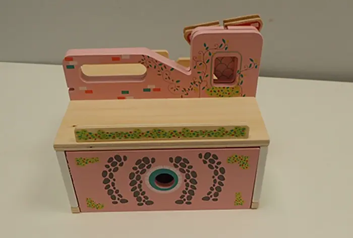 Photo from the official notice: Mini Matters Wooden Portable Doll House — choking risk