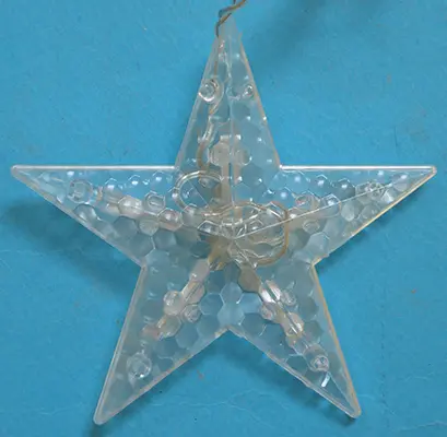 Foto do aviso oficial: Five-pointed star Corrente de iluminação — risco: Queimaduras & Choque elétrico
