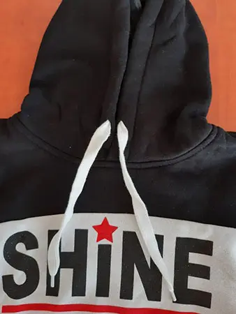 Photo from the official notice: GRACE children's sweatshirt — strangulation risk (A12/00229/21)