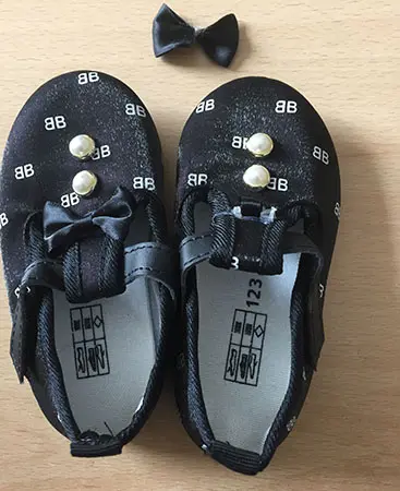 Photo de l’avis officiel: Chaussures pour enfants — risque: Étouffement (A12/00562/21)