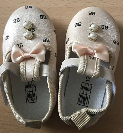 Photo de l’avis officiel: Chaussures pour enfants — risque: Étouffement (A12/00562/21)