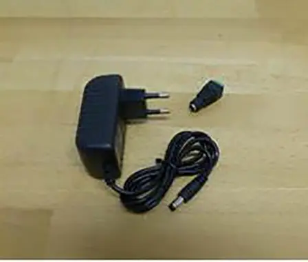 Photo from the official notice: US UK EU DC 12 V 2A- Adaptateur d'alimentation à découpage - Adaptateur de bande lumineuse LED mains adaptor — electric shock risk