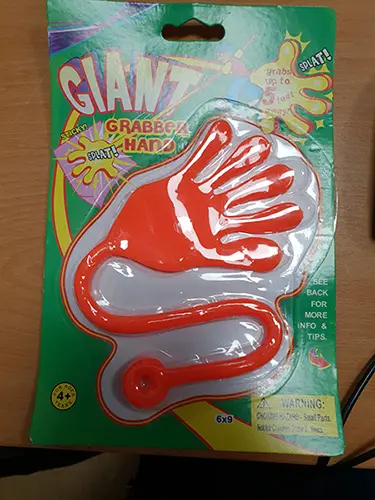 Photo from the official notice: GIANT  grabber hand sticky hand toy — strangulation risk