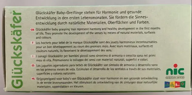 Foto aus der offiziellen Meldung: Glückskäfer Scheibenring Holz Rassel — Risiko: Ersticken