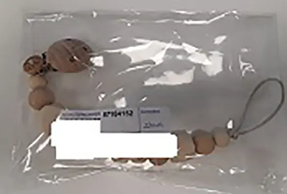Foto aus der offiziellen Meldung: Babyzus Speenkoord Schnullerclip — Risiko: Ersticken