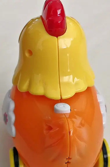 Photo from the official notice: YI BAO KINGDOM JOY CHICKEN plastic toy — choking risk