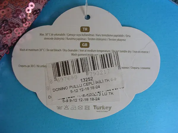 Photo from the official notice: Donino Baby babies' clothing set — choking risk