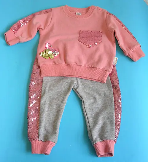 Photo from the official notice: Donino Baby babies' clothing set — choking risk
