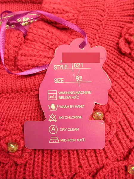 Foto aus der offiziellen Meldung: Yutokids Kinderpullover — Risiko: Ersticken