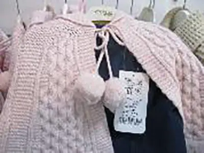 Foto aus der offiziellen Meldung: EAC Kinder Cardigan — Risiko: Strangulierung