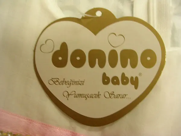 Photo de l’avis officiel: Donino Donino Baby Robe d’enfant — risque: Étouffement