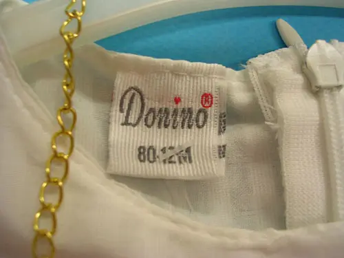 Photo de l’avis officiel: Donino Donino Baby Robe d’enfant — risque: Étouffement