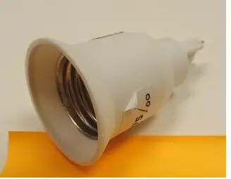 Photo from the official notice: Lamp socket adapter — electric shock risk (A12/00422/22)
