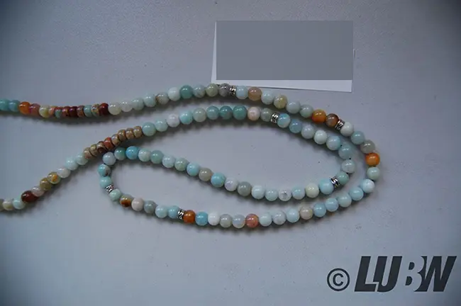 Foto aus der offiziellen Meldung: COAI coai Unisex 108 Mala aus Vielfärbig Amazonit mit BuddhaKopf Armband — Risiko: Chemikalie