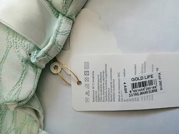 Photo de l’avis officiel: Gold Life Robe d’enfant — risque: Blessures