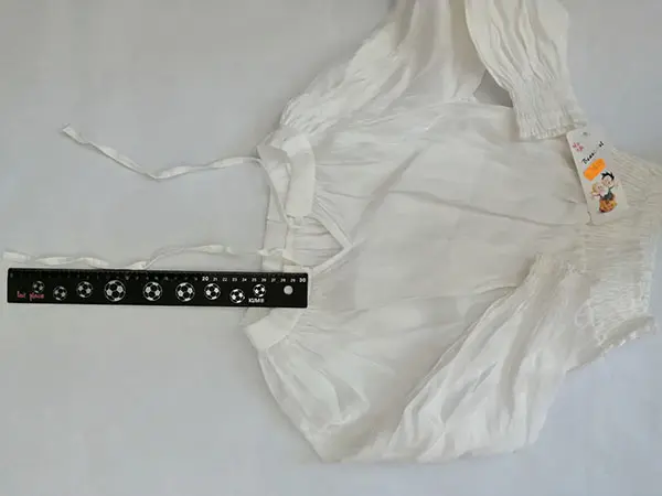 Foto uit de officiële melding: Beautiful Kinderblouse — risico: Verwonding & Verwurging
