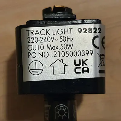 Photo from the official notice: Qazqa Gissi SL 5 black track track light — electric shock risk