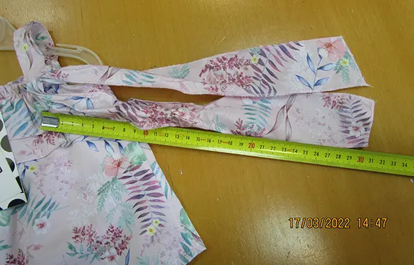 Foto uit de officiële melding: EBITA Kinderkleding set — risico: Verwurging