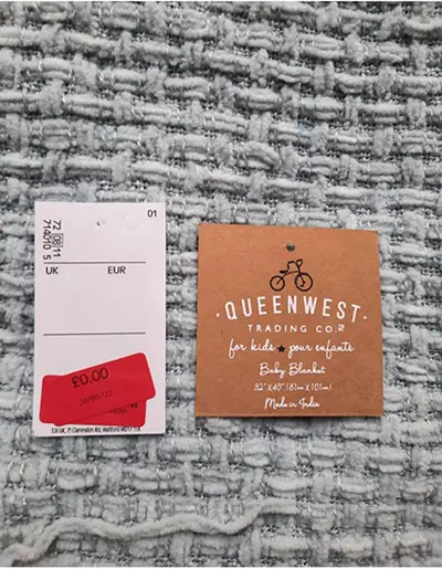 Photo de l’avis officiel: Queen West Trading Co. Couverture bébé — risque: Étouffement & Coincement