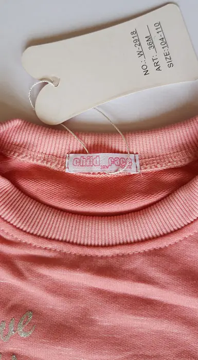 Foto aus der offiziellen Meldung: CHILD FACE Kinderbluse — Risiko: Ersticken