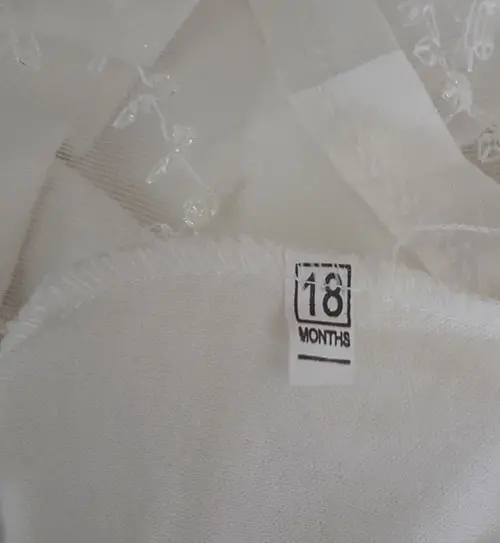 Photo from the official notice: MINI LUCK babies' clothing set — choking risk