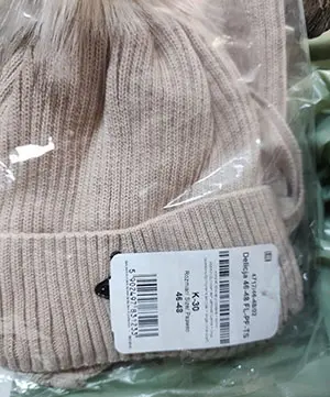 Foto uit de officiële melding: ABGO Telisa, Delicja Kindermuts — risico: Verwonding & Verwurging