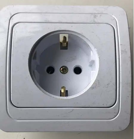Photo from the official notice: Wall socket — electric shock & fire risk
