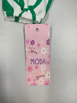 Foto uit de officiële melding: MODA Kinderblouse — risico: Verwonding & Verwurging