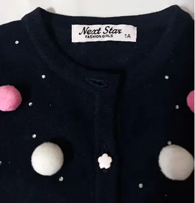 Foto aus der offiziellen Meldung: NEXT STAR Fashion girls Kinderjacke — Risiko: Ersticken