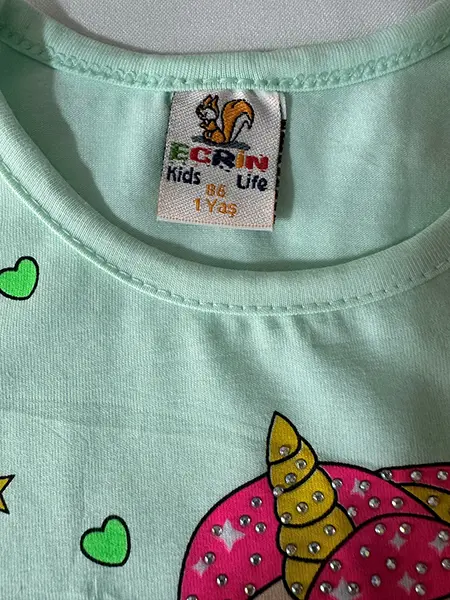Foto do aviso oficial: Ecrin Kids Life T-shirt para crianças — risco: Engasgamento