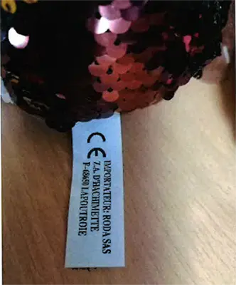 Photo from the official notice: RODA ST. BERNARD soft toy with SEQUINS — choking risk
