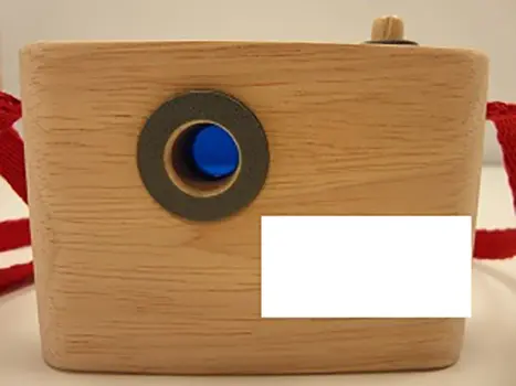 Photo from the official notice: Plan Toys Colored Snap Camera toy camera — strangulation risk