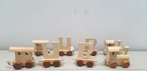 Photo from the official notice: Bino Europe k.s. Locomotive brown wheels, train wagon letter U with brown wheels, train wagon letter R toy tra — choking risk