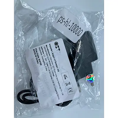 Foto uit de officiële melding: Travel charger Lader — risico: Milieu