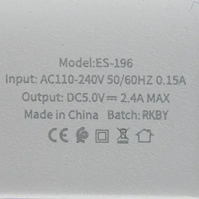 Foto uit de officiële melding: Model:Earldom CHARGER 2USB TRAVEL CHARGER USB-oplader — risico: Elektrische schok