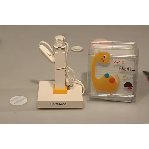 Photo from the official notice: Dalber Dinos children's table lamp — electric shock risk