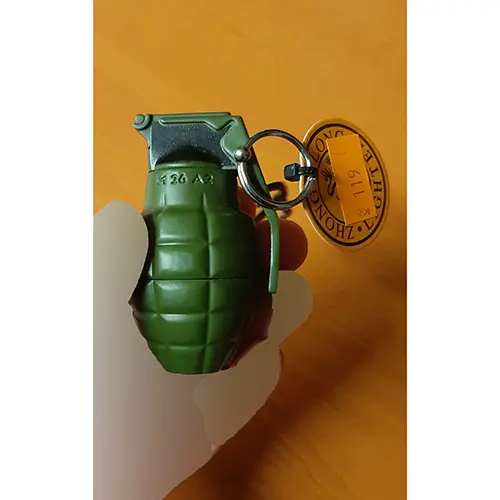 Photo from the official notice: ZHONG LONG® Zapalovač neobvyklého tvaru malý granát novelty lighter — burns risk
