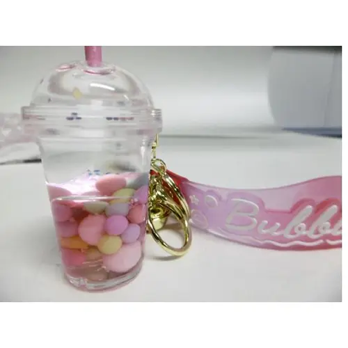 Foto aus der offiziellen Meldung: Porte-clés en forme de tasse de thé aux perles de tapioca fluorescent en acrylique pour femmes Schlüsselanhäng — Risiko: Chemikalie