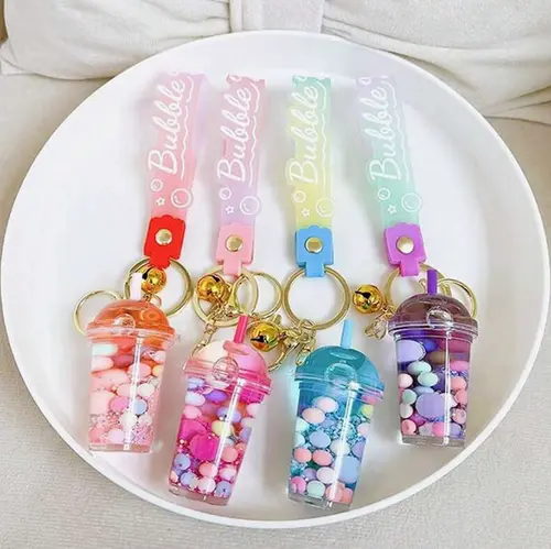Foto aus der offiziellen Meldung: Porte-clés en forme de tasse de thé aux perles de tapioca fluorescent en acrylique pour femmes Schlüsselanhäng — Risiko: Chemikalie