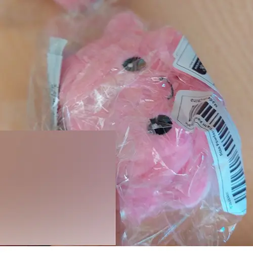 Photo from the official notice: "Plush dolls"- octopus réversible d'humeur key ring with soft toy — choking risk