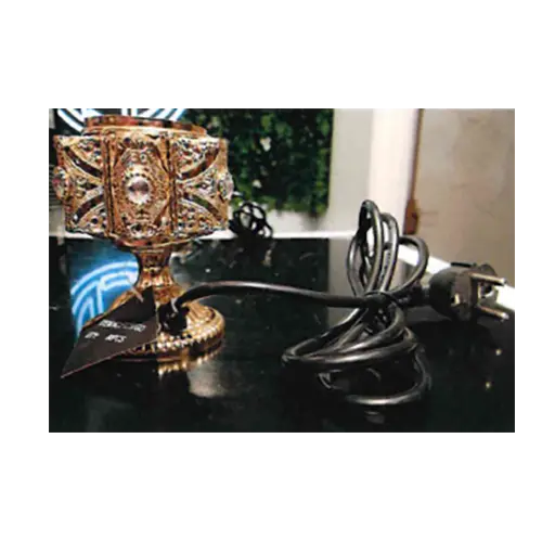 Photo from the official notice: AMIR’S Deco Bruleur d'encens électrique de luxe electric incense burner — electric shock & fire risk