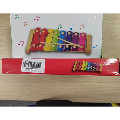 Photo from the official notice: Hand knocks the xylophone musical toy — choking risk