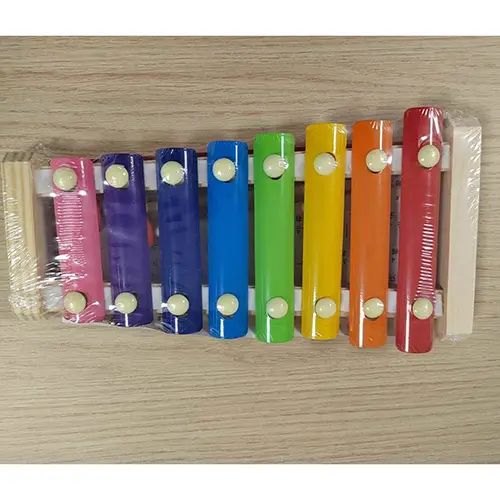 Photo from the official notice: Hand knocks the xylophone musical toy — choking risk