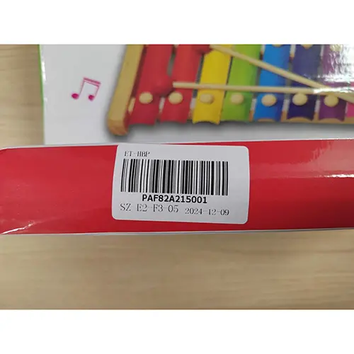 Photo from the official notice: Hand knocks the xylophone musical toy — choking risk